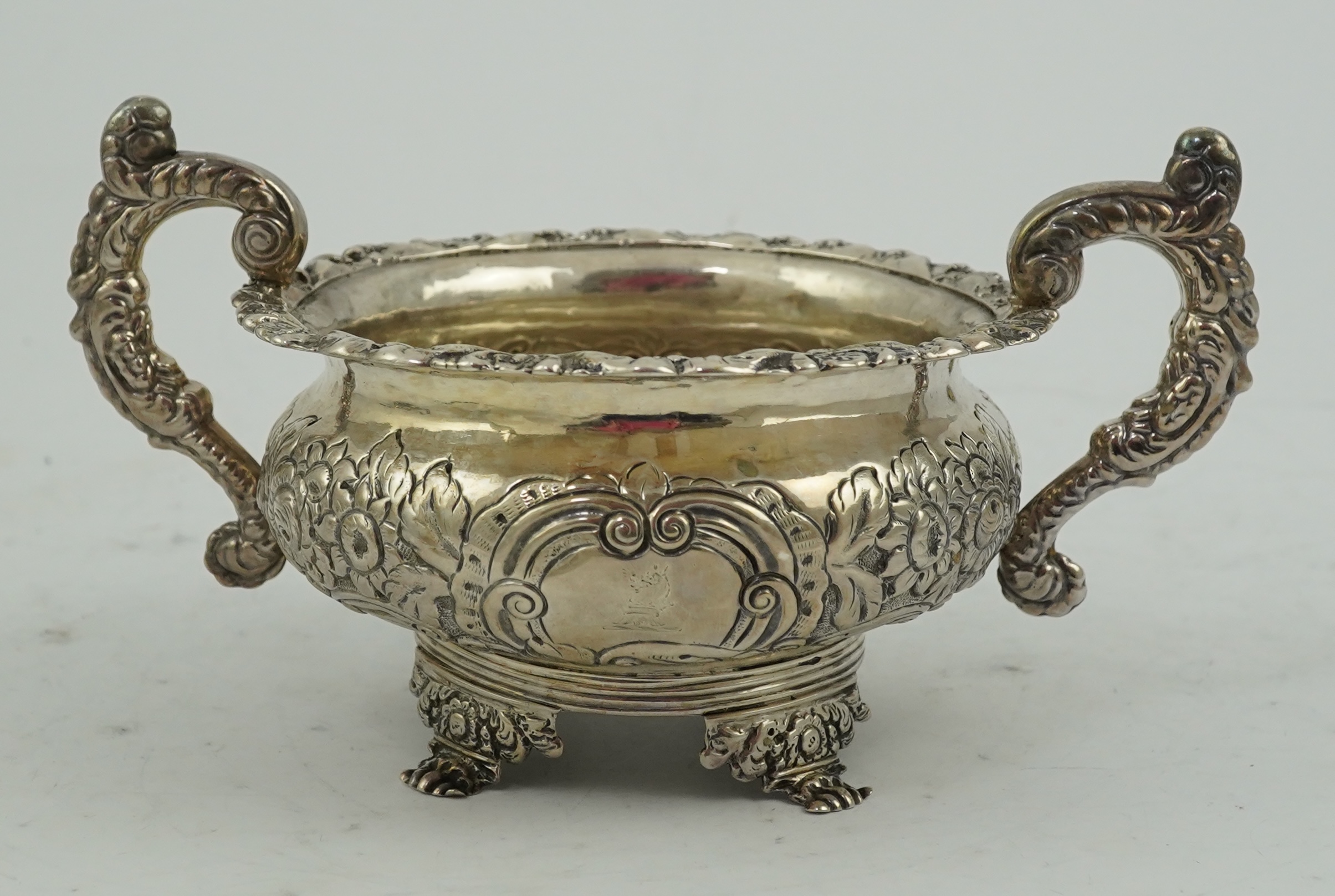 A George IV Irish embossed silver two handled sugar bowl, by James Scott